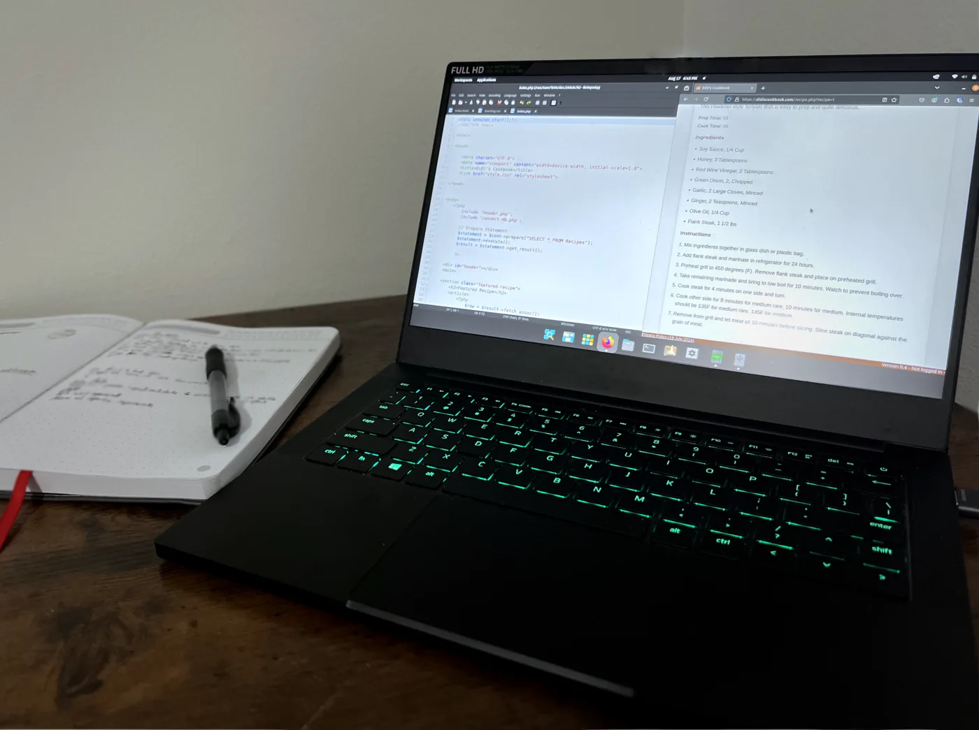 Developer workstation with code and interface mockups for a custom software project